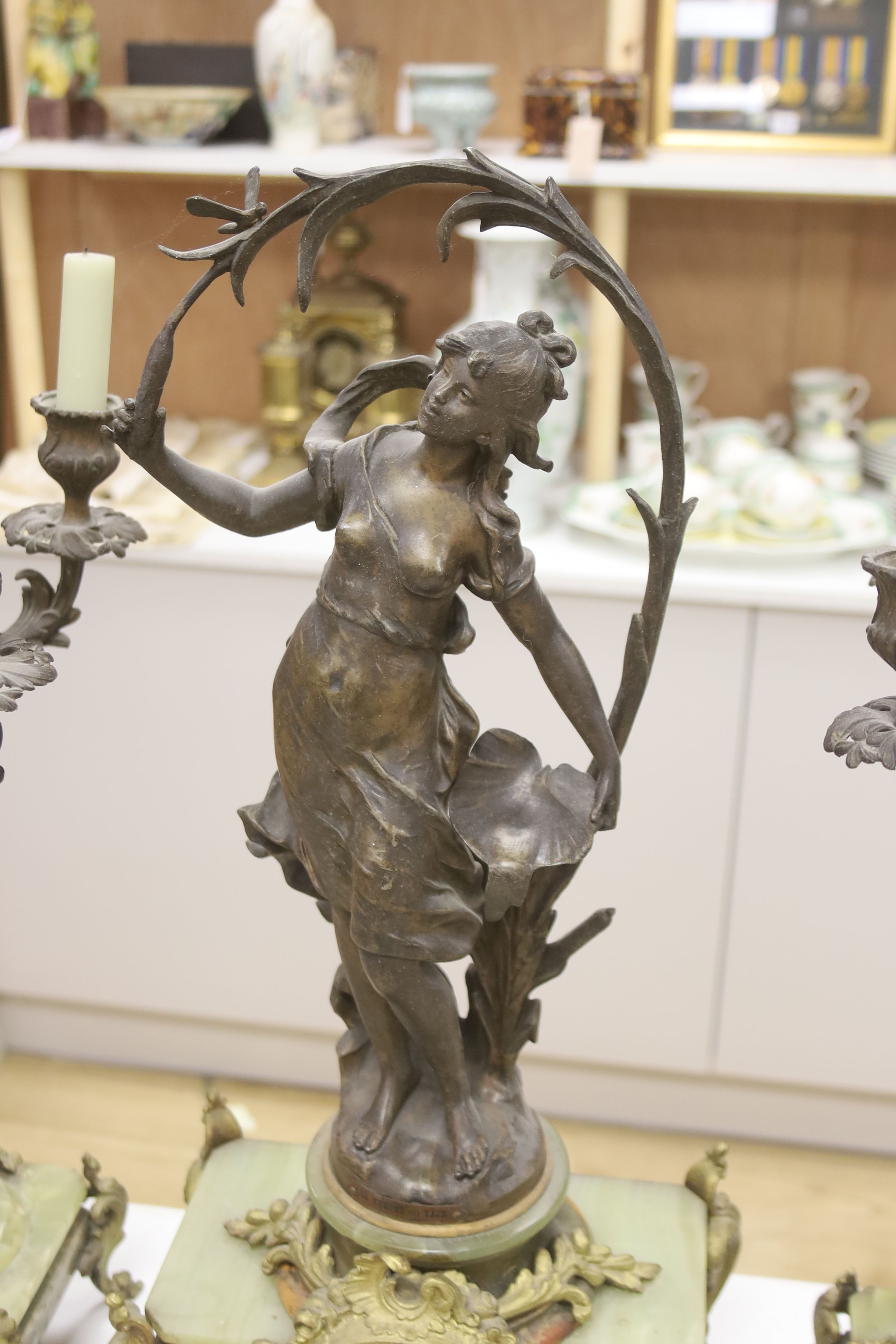 A 19th century French spelter and onyx clock garniture, height 61cm